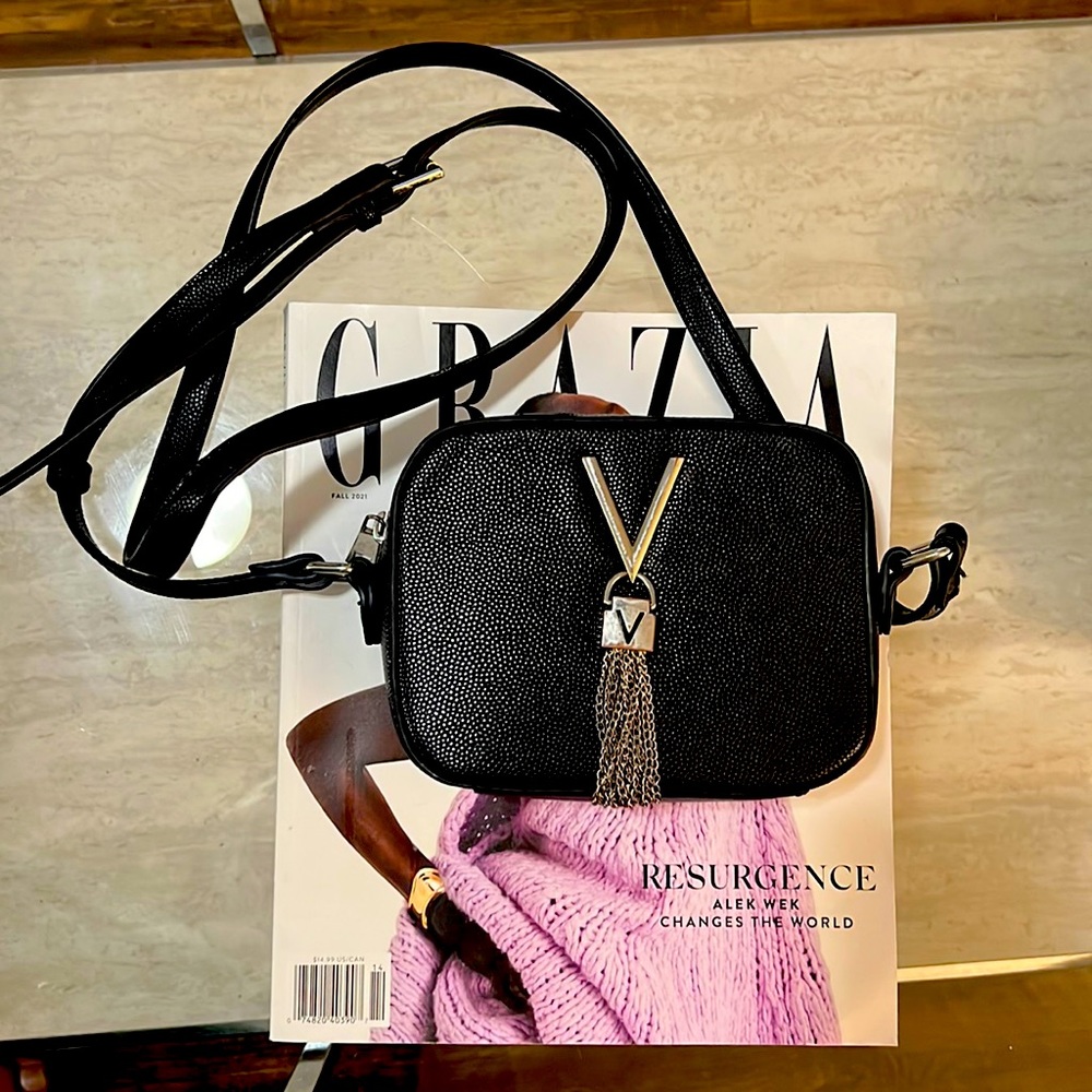 Black leather Valentino crossbody camera bag.